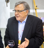 A man with a glass of wine